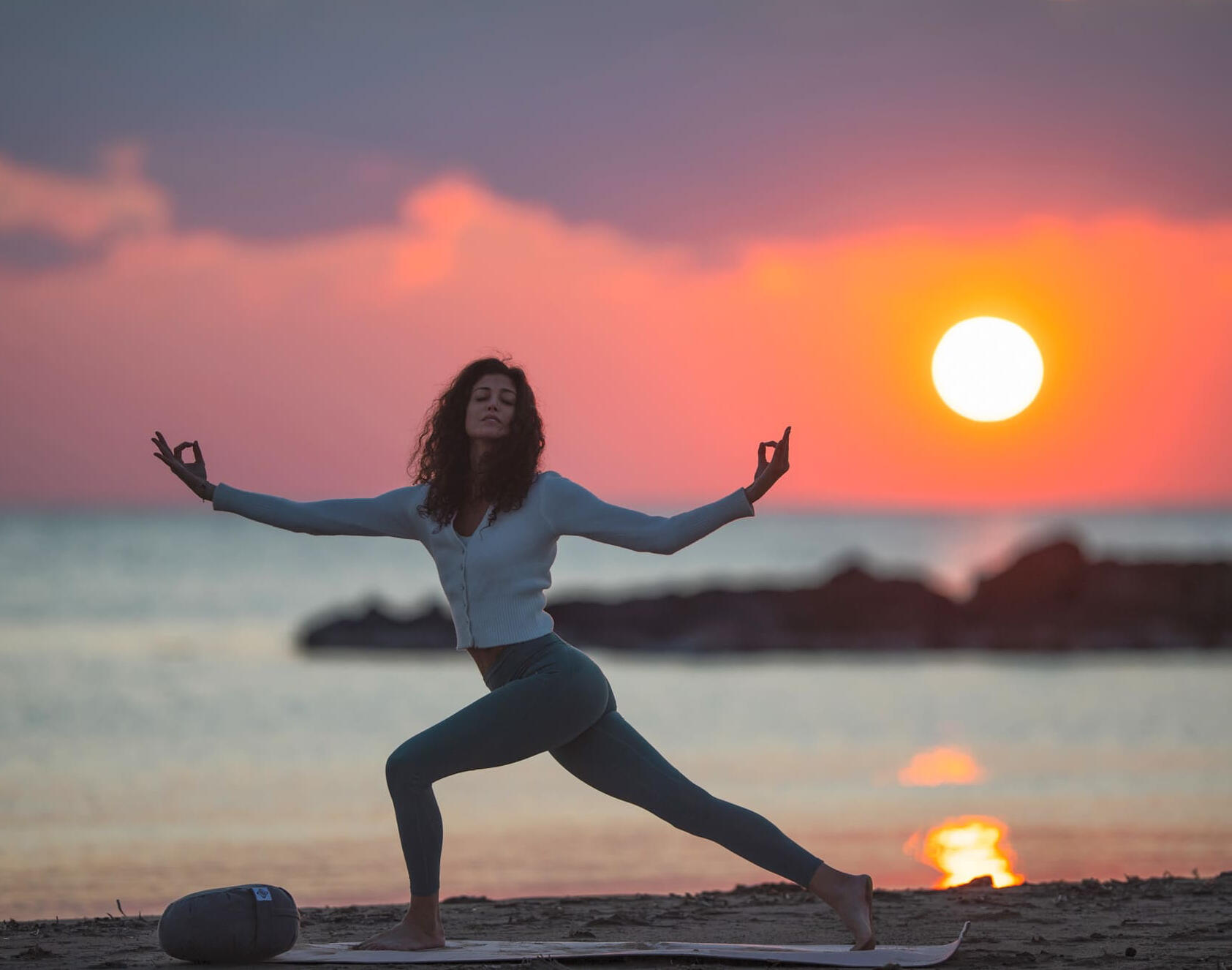Yoga session at sunset on villa terrace in Capri